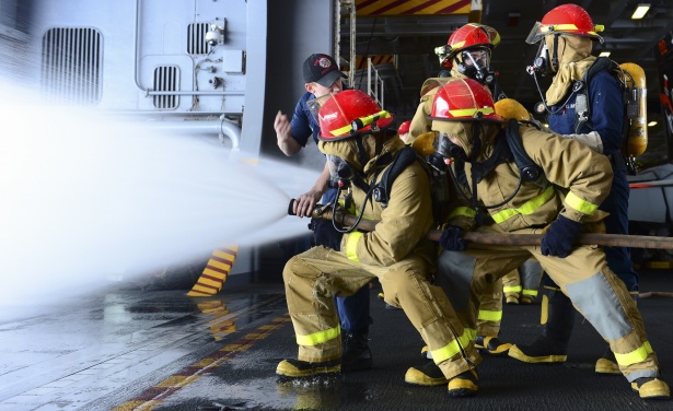 A fire marshal reviewing plans at a desk